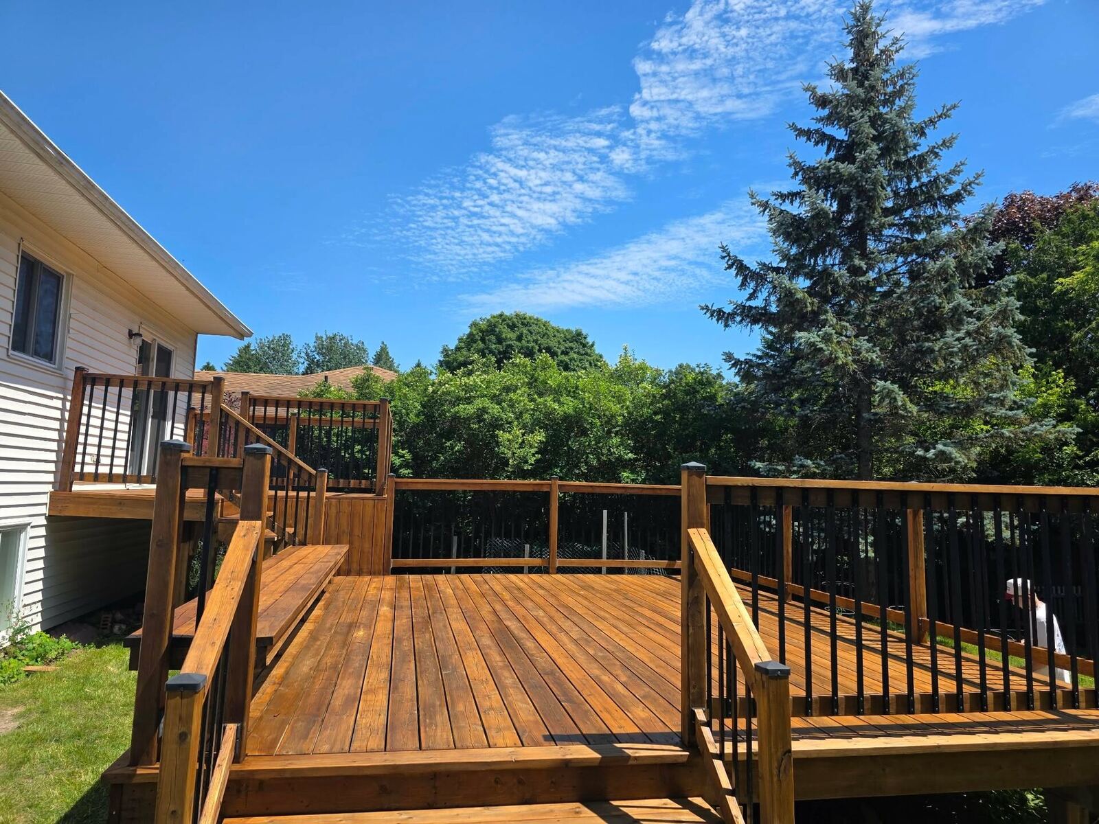 Finished deck, wide sunny view, oil-stained cedar tone